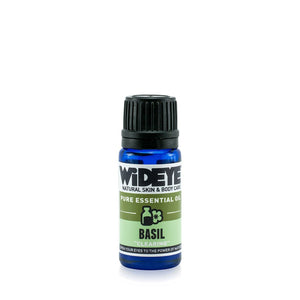 Natural vegan Basil essential oil in glass bottle for aromatherapy.