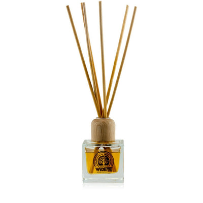 Natural aromatherapy essential oil 'Beach Bum' reed diffuser in glass bottle made by WiDEYE in Rye.